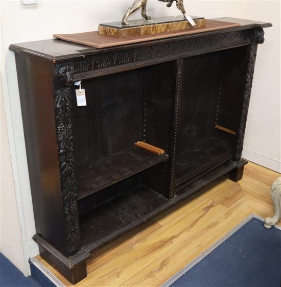 A 19th century carved oak open bookcase W.153cm